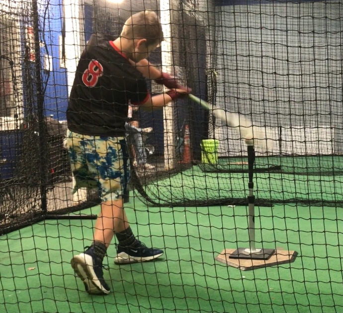 R2 hitting client hitting off the tee